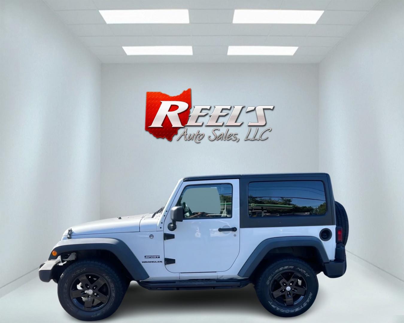 2013 White /Black Jeep Wrangler Sport 4WD (1C4AJWAG7DL) with an 3.6L V6 DOHC 24V engine, 6 Speed Manual transmission, located at 11115 Chardon Rd. , Chardon, OH, 44024, (440) 214-9705, 41.580246, -81.241943 - Photo#13